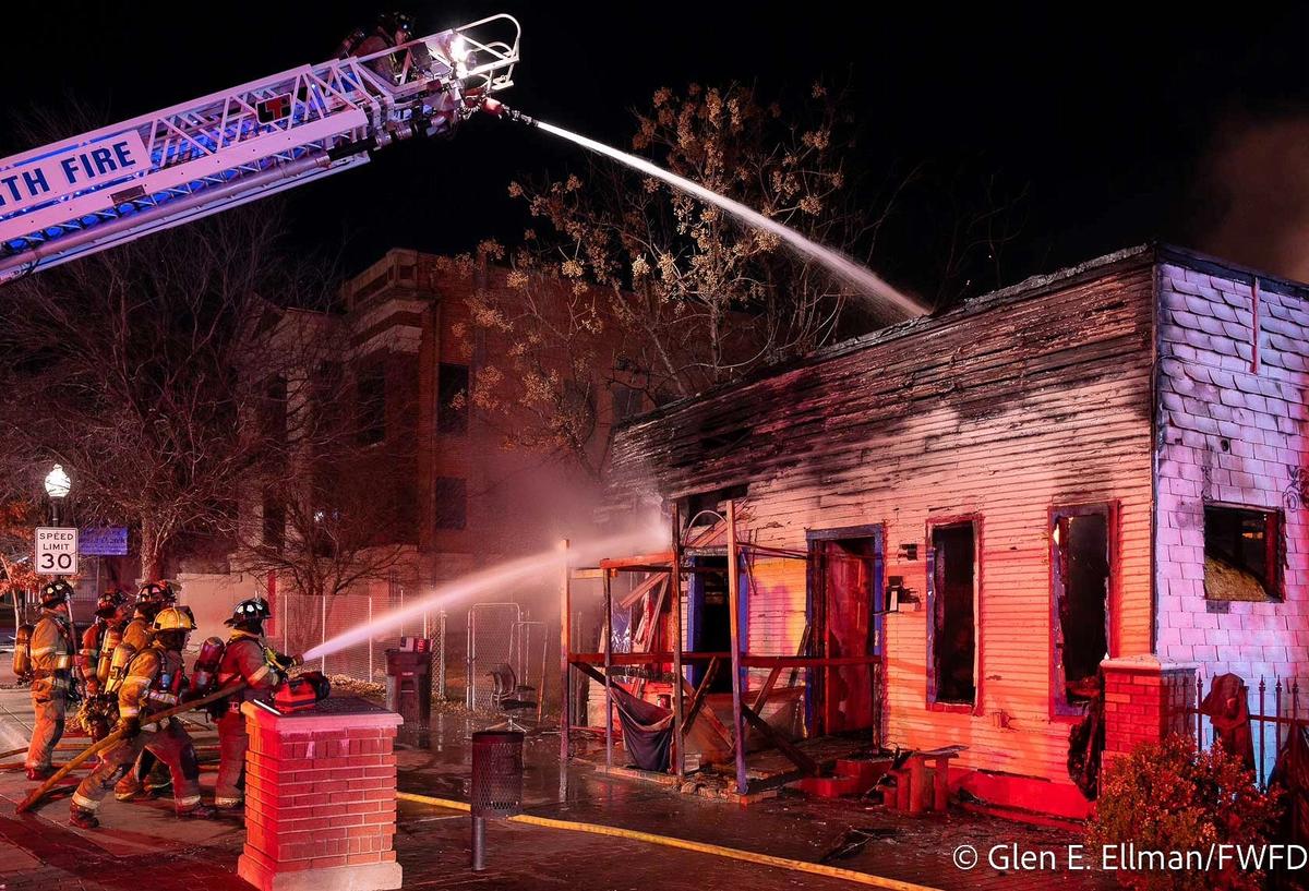 Fort Worth fire crews fight to extinguish a fire at the original Juneteenth museum and two other houses on Wednesday, Jan 11.