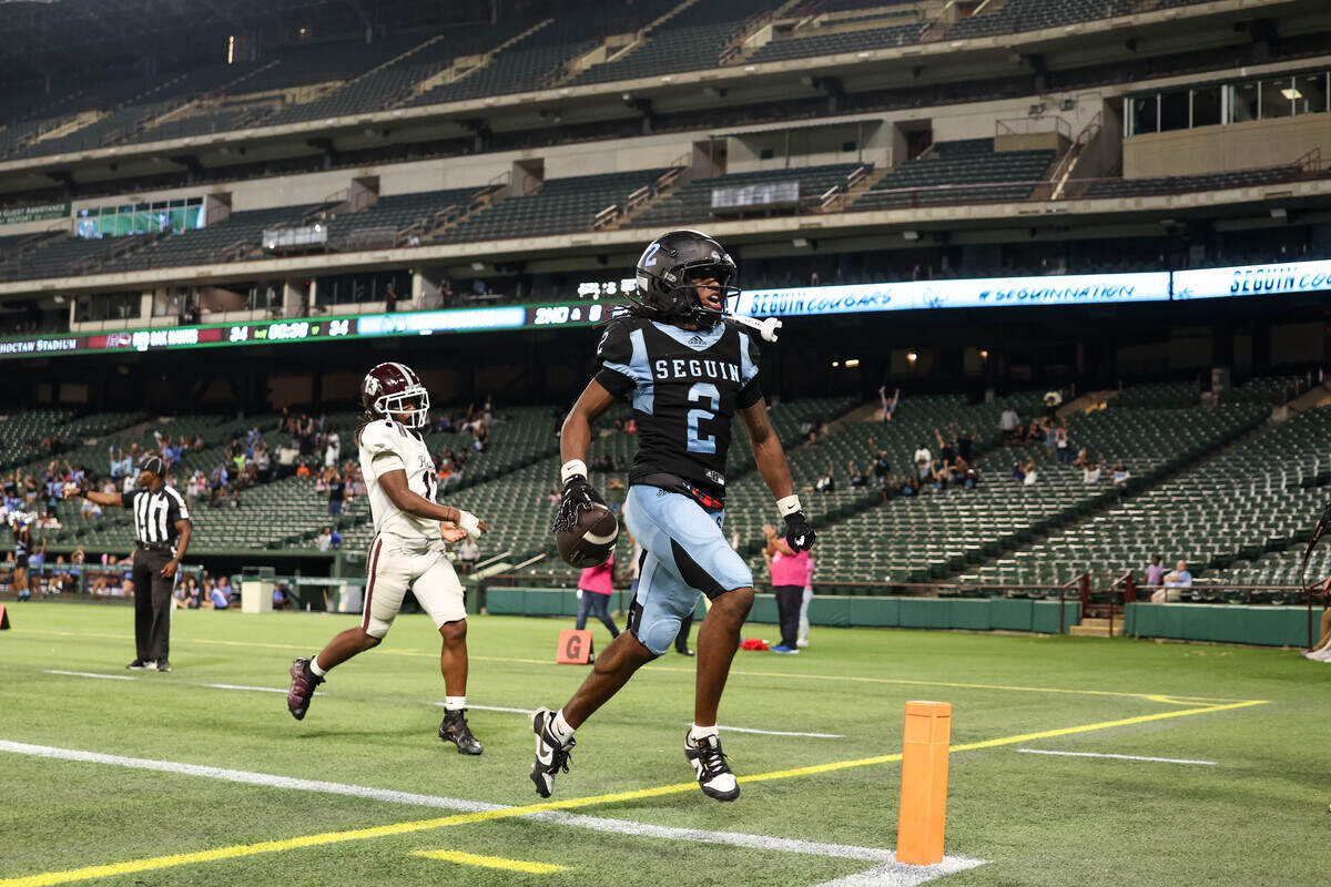 Arlington Seguin receiver Gmanii Smith screams as he runs into the back of the endzone for a go-ahead touchdown, as Arlington Seguin beat Red Oak 41-34 in a non-district game at Choctaw Stadium in Arlington, Texas on Sept. 4, 2025.
