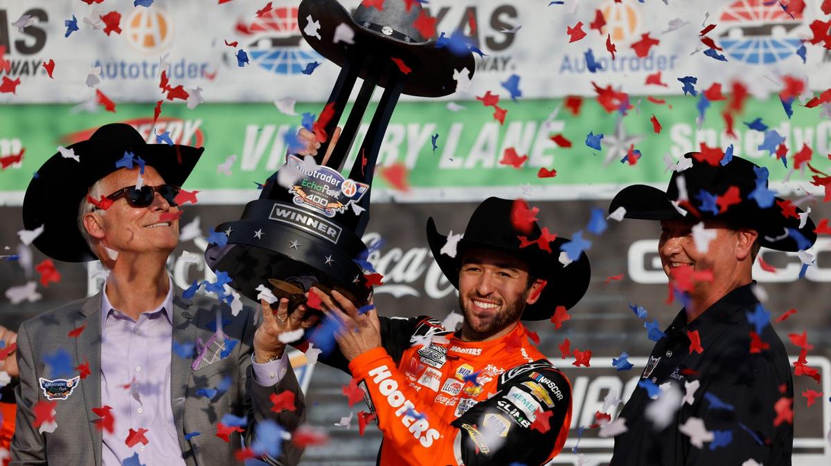 Chase Elliott hoists the trophy after winning the Auto Trader Echo Park 400 at Texas Motor Speedway in Fort Worth, Texas, April 14, 2024.