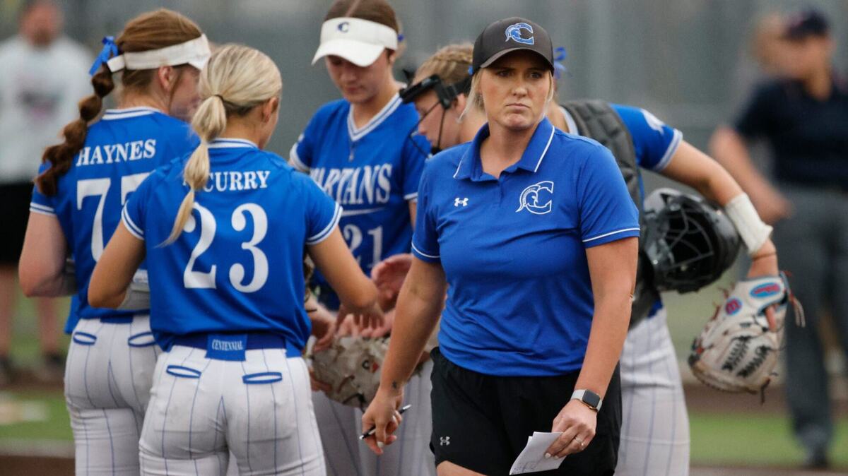 Burleson Centennial head coach Natalie Mullin walks back to the dugout after a mound visit during the Class 5A Region I final in May 2024 at Aledo.