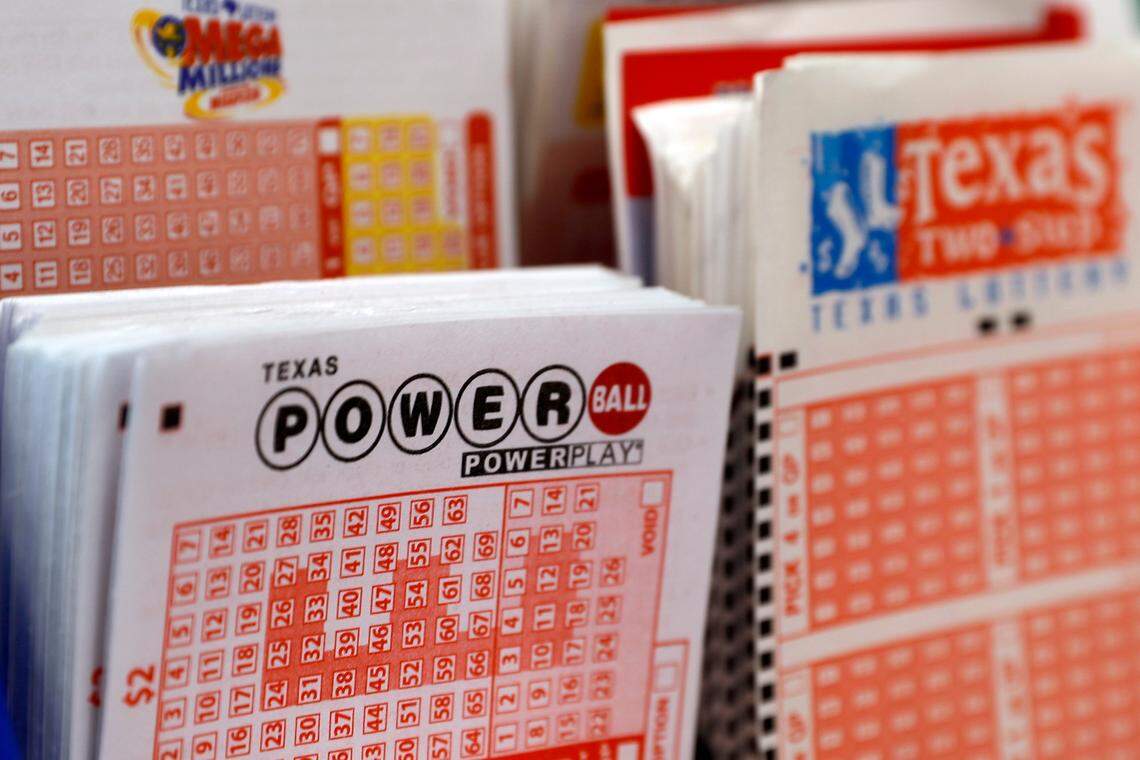 A play slip for the Power Ball lottery sits in a holder at a convenience store in Dallas, Texas on March 26, 2020.