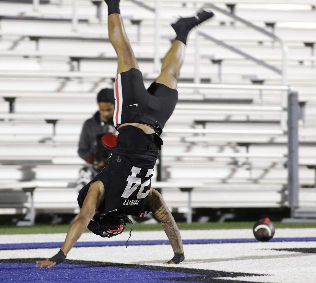 Euless Trinity running back JT Harris celebrates in the end zone after a long touchdown run against Keller during their game on Friday, October 17, 2025 at Pennington Field in Bedford, Texas. Harris rushed for 271 yards and four touchdowns.