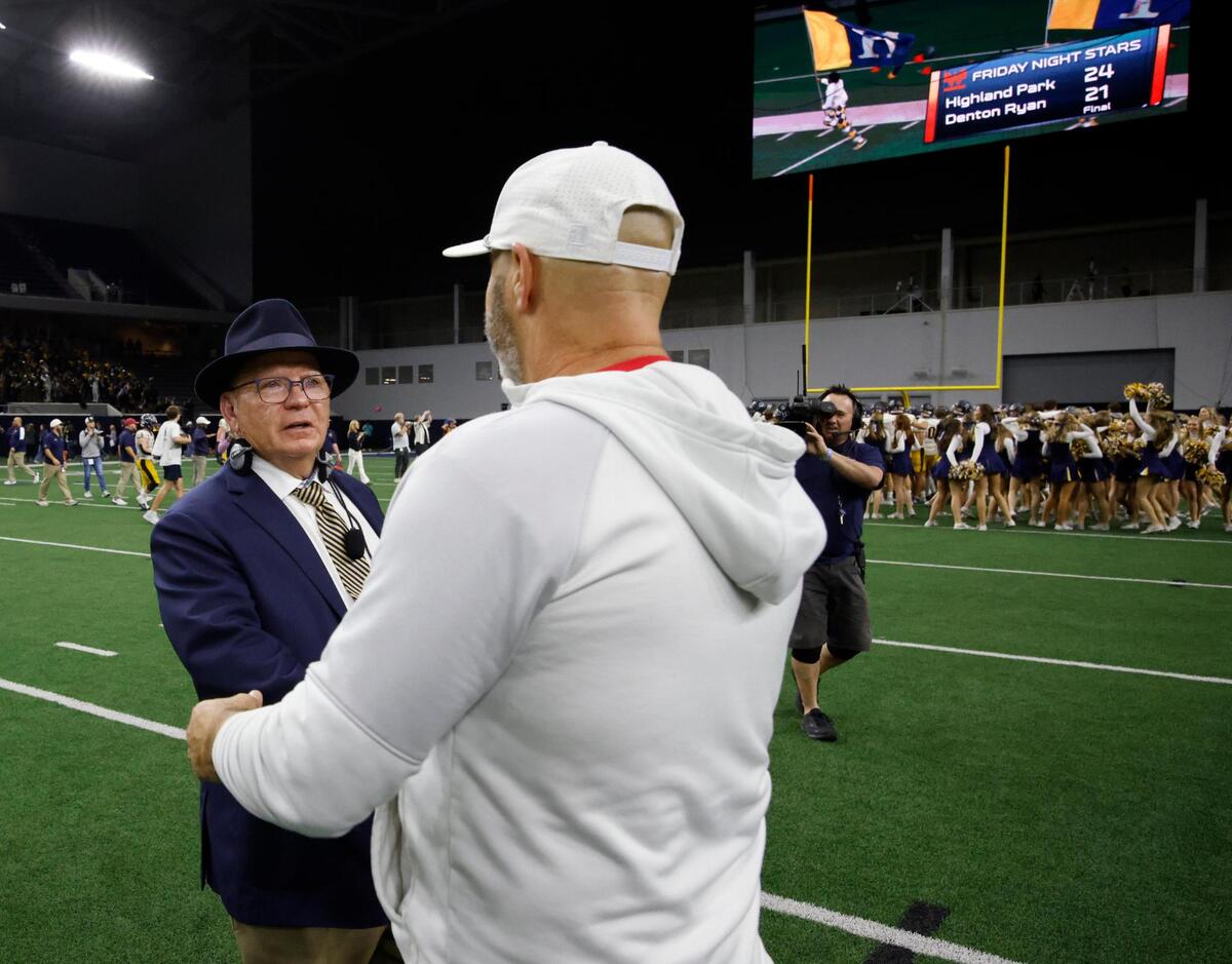 Highland Park head coach Randy Allen is greeted by Denton Ryan head coach Dave Henigan at mid field after winning the UIL 5A D1 Semifinals football game at The Ford Center in Frisco, Texas, Friday, Dec. 13, 2024.