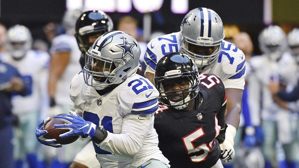 Dallas Cowboys running back Ezekiel Elliott runs against Atlanta Falcons linebacker Foye Oluokun in the second half of Sunday’s 22-19 Cowboys’ win.