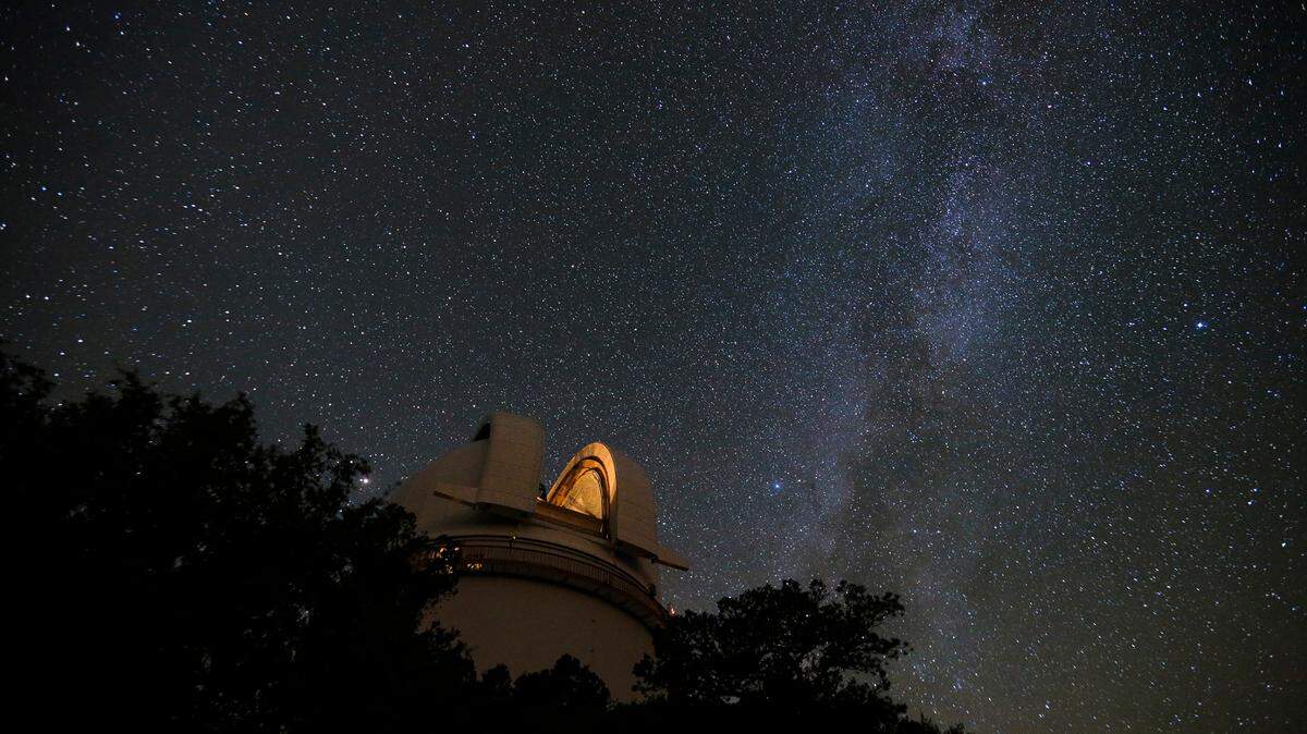 The Milky Way Galaxy streams across the sky above the McDonald Observatory. (Ryan Michalesko/The Dallas Morning News/TNS)