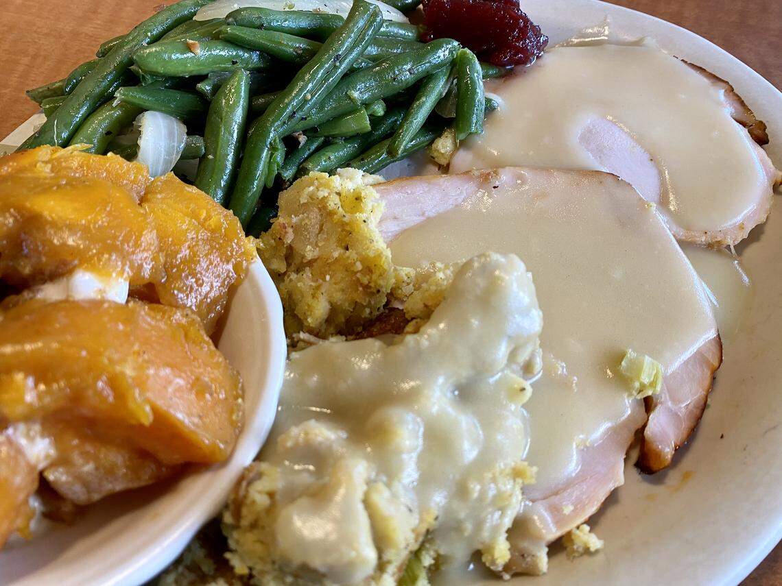Turkey and dressing with a light giblet gravy, yams and green beans at Luby’s Cafeteria.