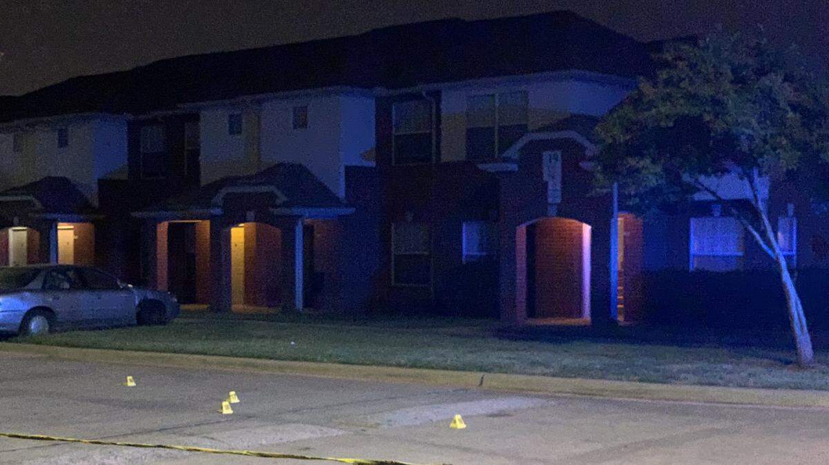 Yellow police tape marks off an area in the 2400 block of Bickers Street where a shooting occurred early Tuesday morning, with bullets going through a home and striking a man, killing him. The suspects were at large as of Tuesday morning.
