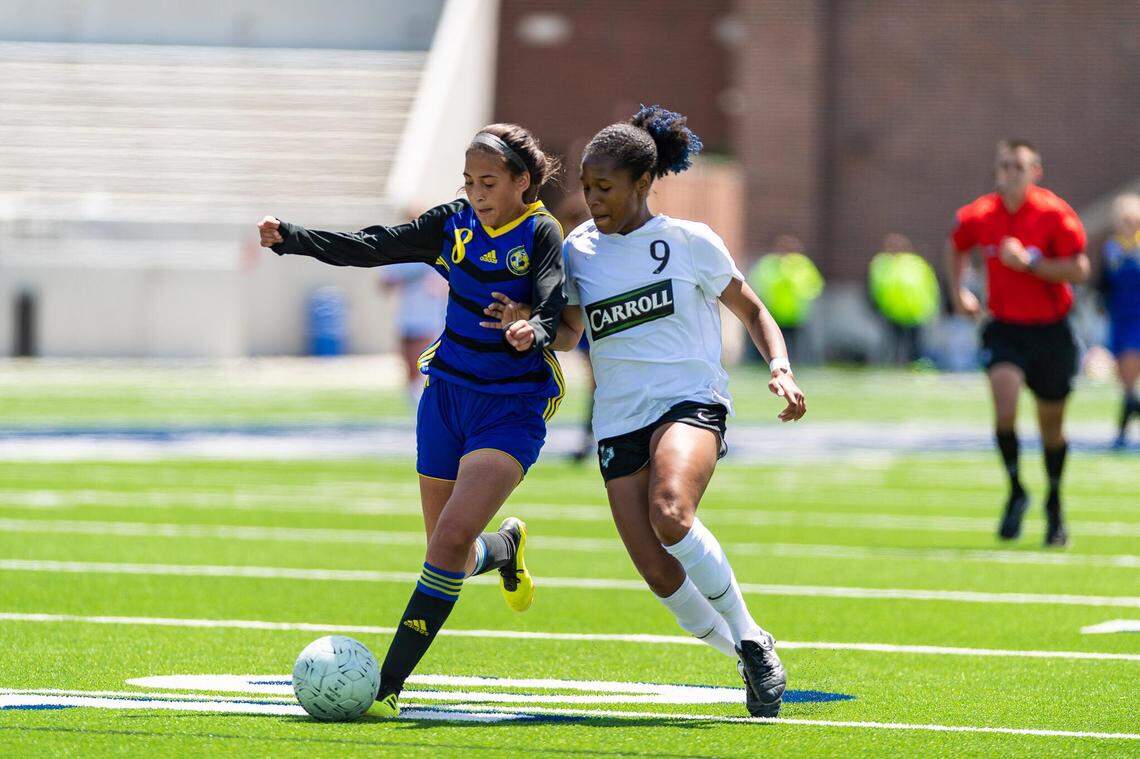 Carroll senior and Texas signee Sydney Nobles (9) up against a Frenship player during the 6A Region I tournament, Friday April 12, 2019 at McKinney ISD Stadium.