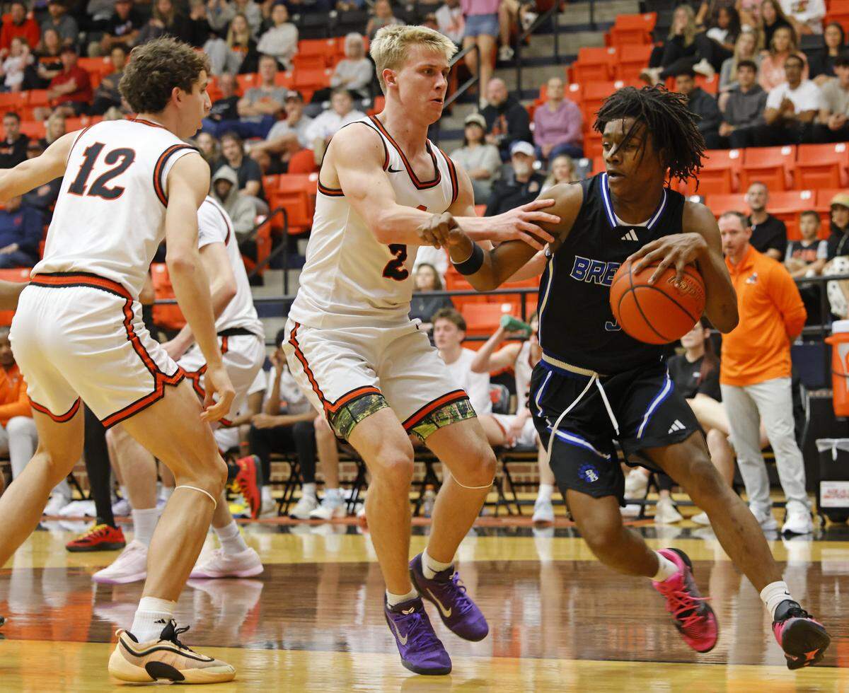 Aledo forward Cooper Hull (2) defends against Brewer guard Braelon Orr (3) during the first half of a UIL boys basketball game at Aledo High School in Aledo, Texas, Friday Feb. 13, 2026.