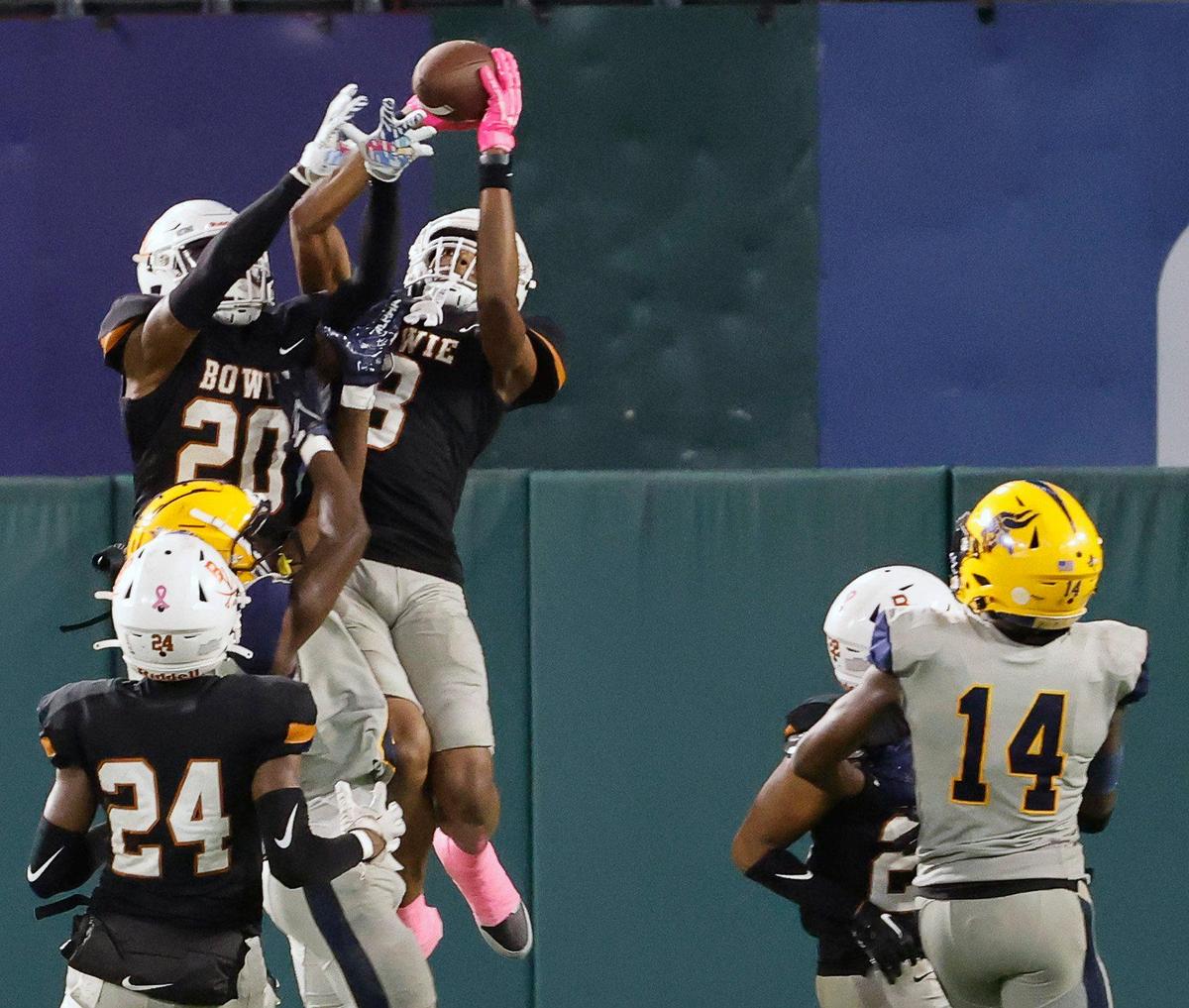 Bowie wide receiver Dilon Jackson (8) high points the ball for an interception that sealed a come back for Lamar in the second half of a UIL high football game at Choctaw Stadium in Arlington, Texas, Thursday, Oct. 26, 2023. Bowie defeated Lamar 31-29. With the win Bowie clinched their playoff berth. (Special to the Star-Telegram Bob Booth)