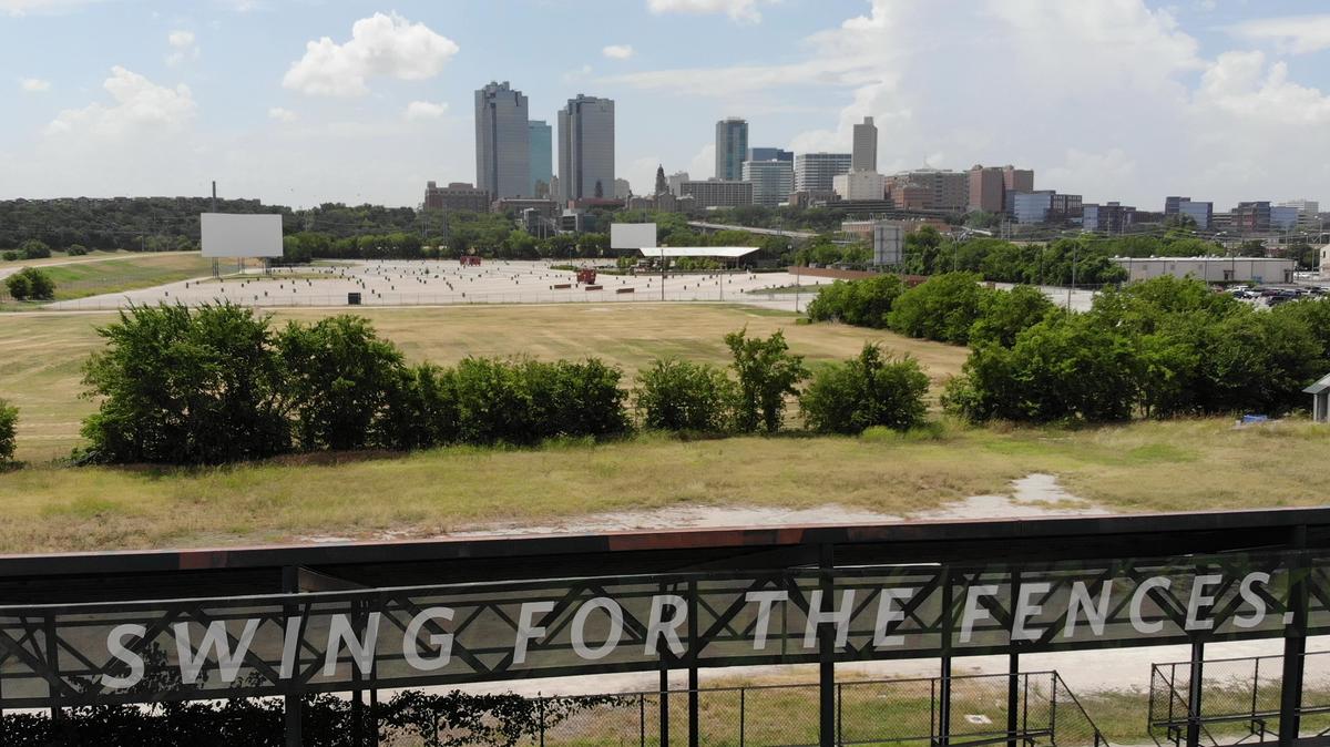 Part of the downtown skyline is visible from La Grave Field. Several tracks of land around the abandoned stadium are for sale on Panther Island.