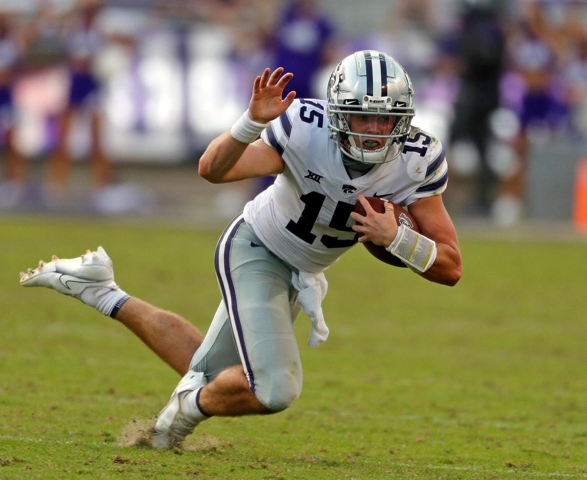 Kansas State quarterback Will Howard (15) trips up on the turf surrendering the ball for a fourth down with 1:15 remaining in the second half of a NCAA football game at Amon Carter Stadium in Fort Worth, Texas, Saturday, Oct. 10, 2020. Kansas State defeated TCU 21-14. (Special to the Star-Telegram Bob Booth)