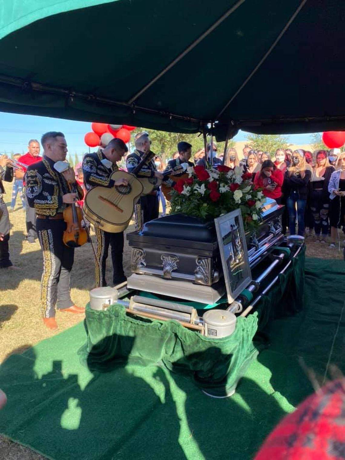 A mariachi band and mourners gather around a casket with the body of Andrew Elizondo inside during his funeral on Sunday. He was killed in a shooting at a house party in north Fort Worth early on Oct. 25.