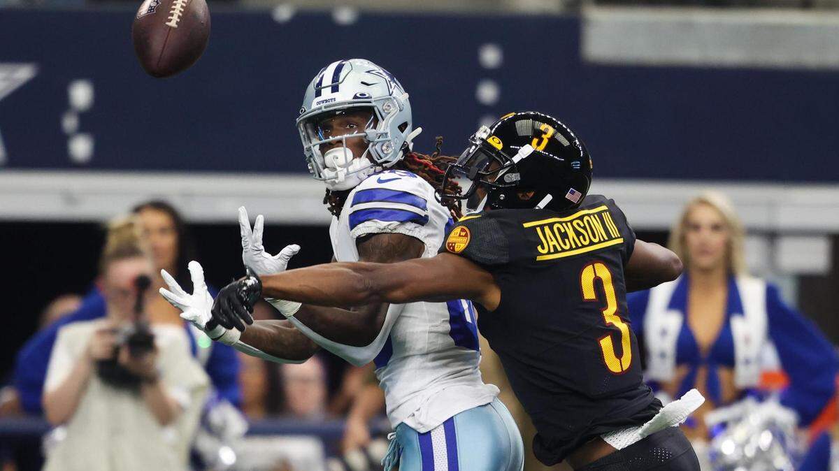 Dallas Cowboys CeeDee Lamb fights with Washington Commanders William Jackson III for the pass Sunday, Oct. 2, 2022, at AT&T Stadium in Arlington.