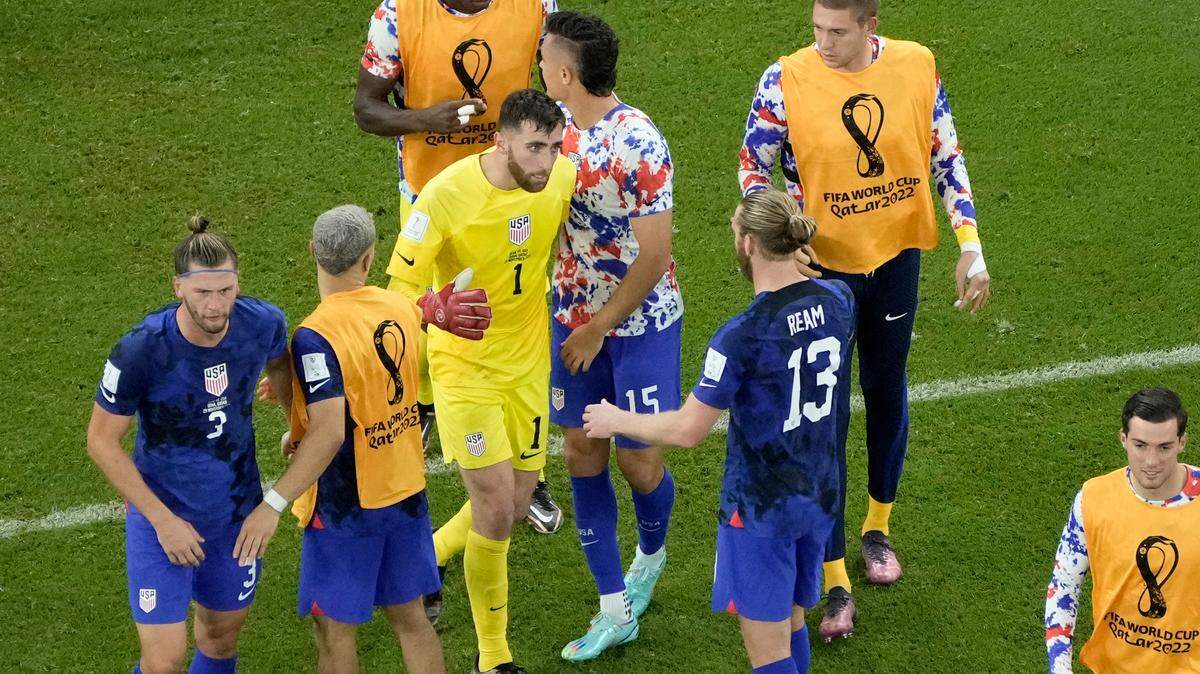 Goalkeeper Matt Turner of the United States, center left, celebrates with teammate Tim Ream center right, at the end of the World Cup group B soccer match between Iran and the United States at the Al Thumama Stadium in Doha, Qatar, on Wednesday.