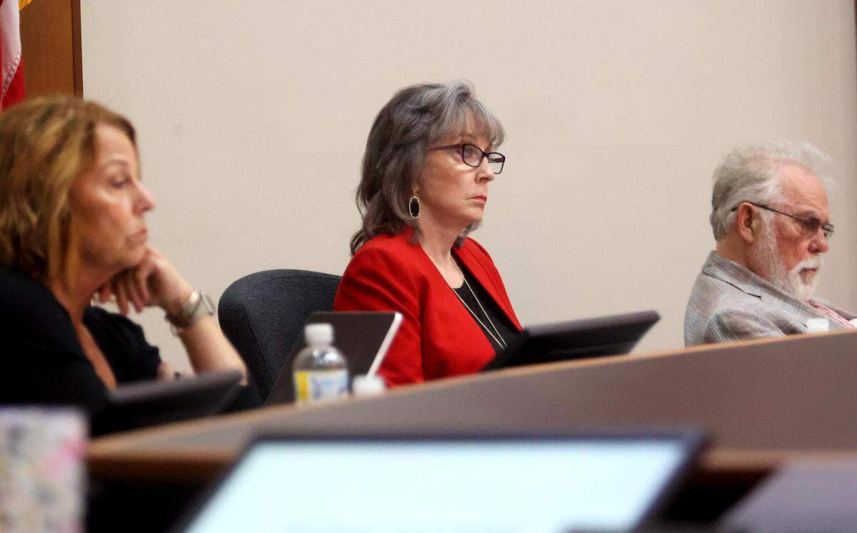 Grapevine City Council member Sharron Rogers, center, listens with other members of the council and mayor to a presentation on purchasing card issues on Tuesday.