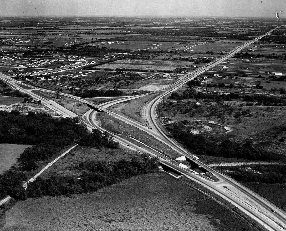 Oct. 31, 1950: This air view shows the $630,000 grade separation of State Highway 121 to Grapevine, left, and State Highway 183 to Dallas, right. Tarrant County’s incorporated town - Richland Hills - a residential project, is at the top left. Along the new four-lane highway to Dallas, construction of a shopping center was underway. A second residential development was under way south off 183.