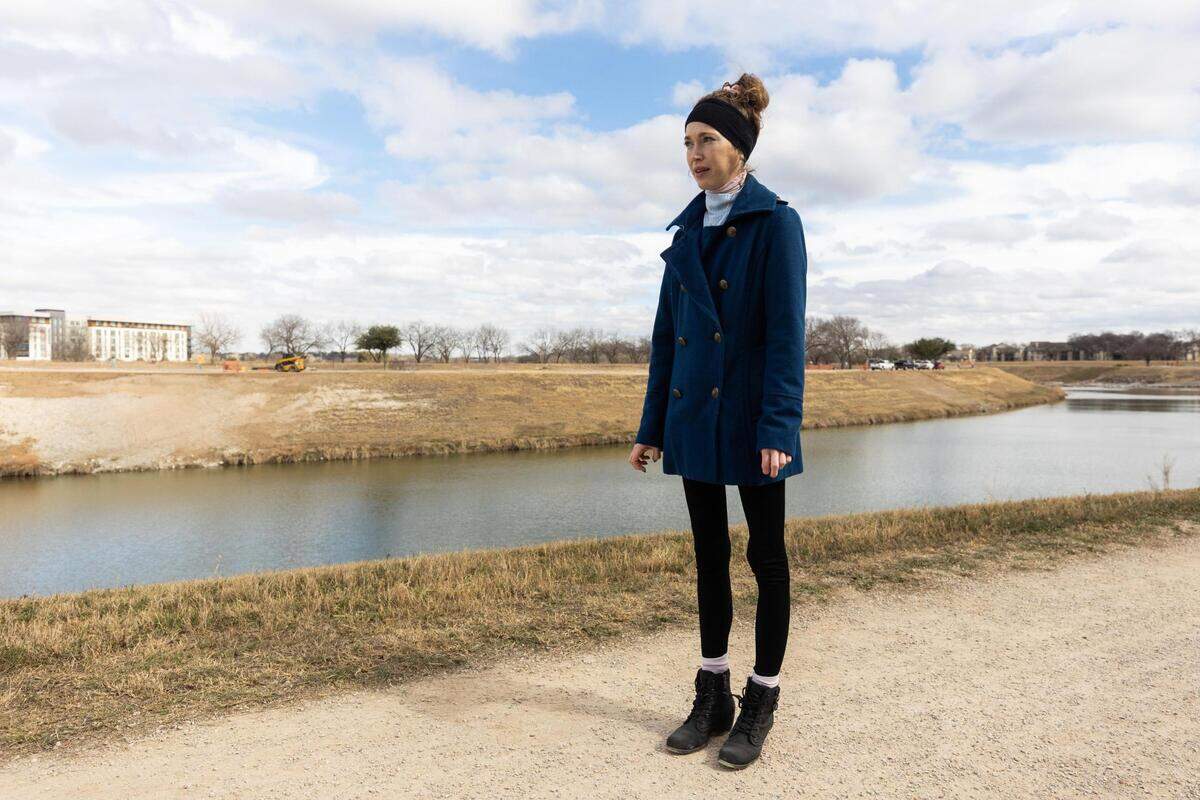 Jesca Arnold walks on Feb. 1, 2022, to the area where she was attacked in 2017 along the Trinity Trails near the Clearfork Trailhead in Fort Worth. When she told her attacker she was calling 911, “he got livid and lunged at me, grabbed my phone and threw it in the river,” Arnold said.