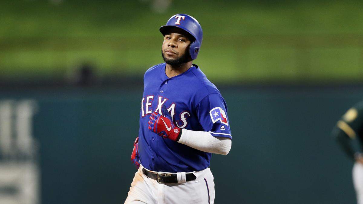 Elvis Andrus circles the bases after launching the first grand slam of his career. It gave the Rangers a 10-2 lead in the sixth. It didn’t go too well after that.