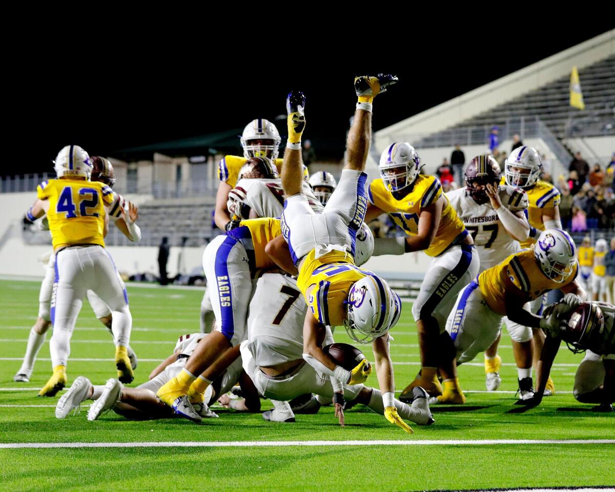 Brock wide receiver Reid Watkins (25) leaps over the line for the winning touchdown in the second half of a UIL Class 3A D1 Region 1 final football game at C. H. Collins Athletic Complex in Denton, Texas, Thursday, Dec. 01, 2022. Brock defeated Whitesboro 30-19. (Special to the Star-Telegram Bob Booth)