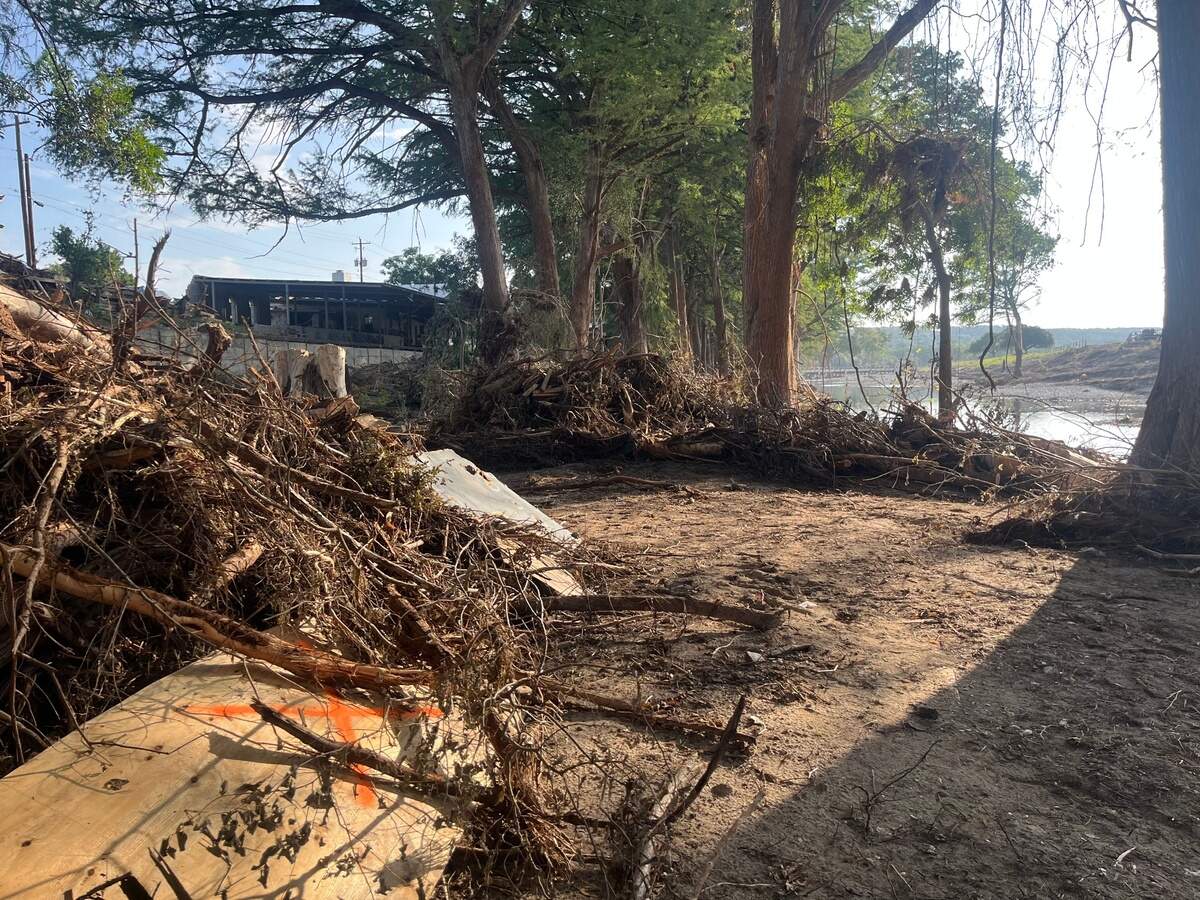 The North and South forks of the river come together about 150 yards down from the Fell home. Christian Fell, 25, survived by clinging to a meter box.