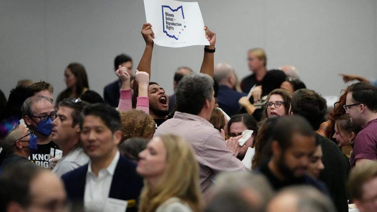 Supporters of Ohio’s Issue 1, to establish a constitutional right to abortion, react to the projected passage of the issue during a gathering Nov. 7 in Columbus, Ohio.