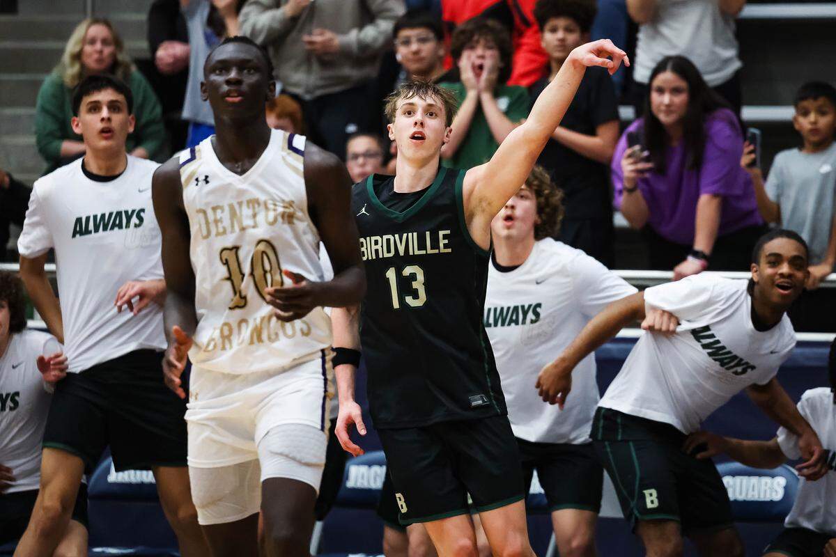 Birdville guard Avery Webb (13) follows through on a three pointer, defended by Denton’s Lojok Loliwa (10), that would end up being the go-ahead, winning shot in a UIL Class 5A Divison I regional final at Flower Mound High School in Flower Mound, Texas, Friday, March 6, 2026.