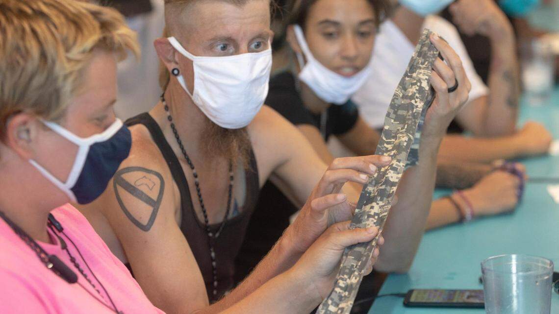 Homeless people in Texas try to stay cool in July 2022 heat.