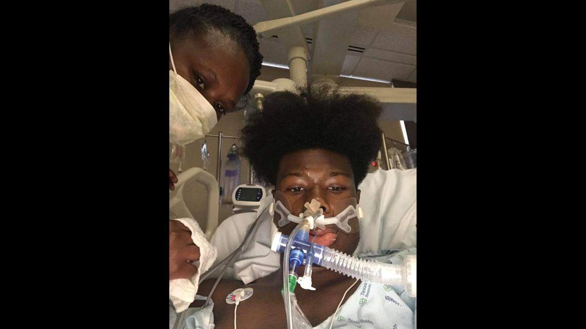 North Crowley senior Michael Hall, pictured with his mother Jessica Johnson, in the hospital after a car accident in May 2020.
