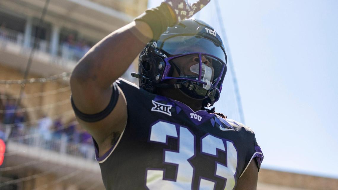 TCU running back Kendre Miller waves after scoring a touchdown during their game against OU at the Amon G. Carter Stadium in Fort Worth, Texas, on Saturday, Oct. 1, 2022. Miller is one of the most productive backs in the country.