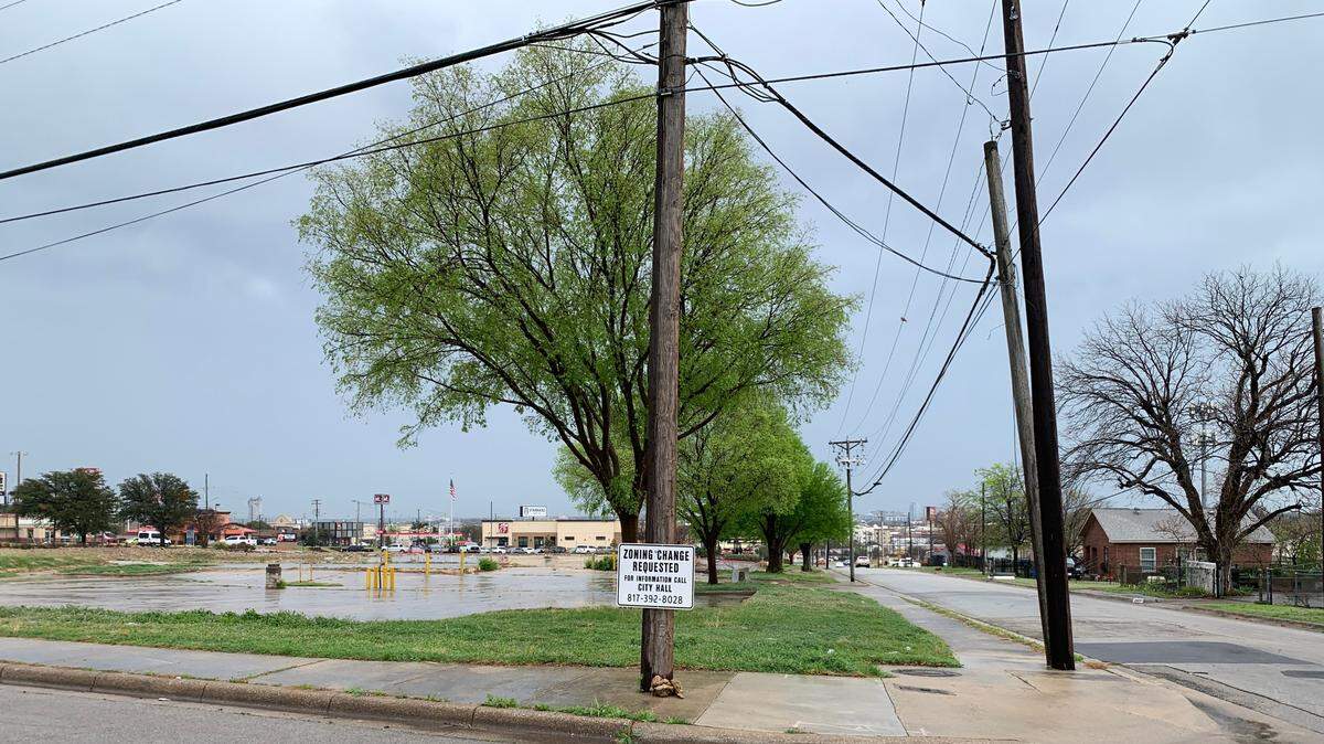 A zoning change sign on the corner of Ellis Avenue and NW 29th Street in Northside Fort Worth. Developers want to build a hotel on the long-abandoned land, which borders a row of residential homes. Nearby residents have mixed thoughts on the project.