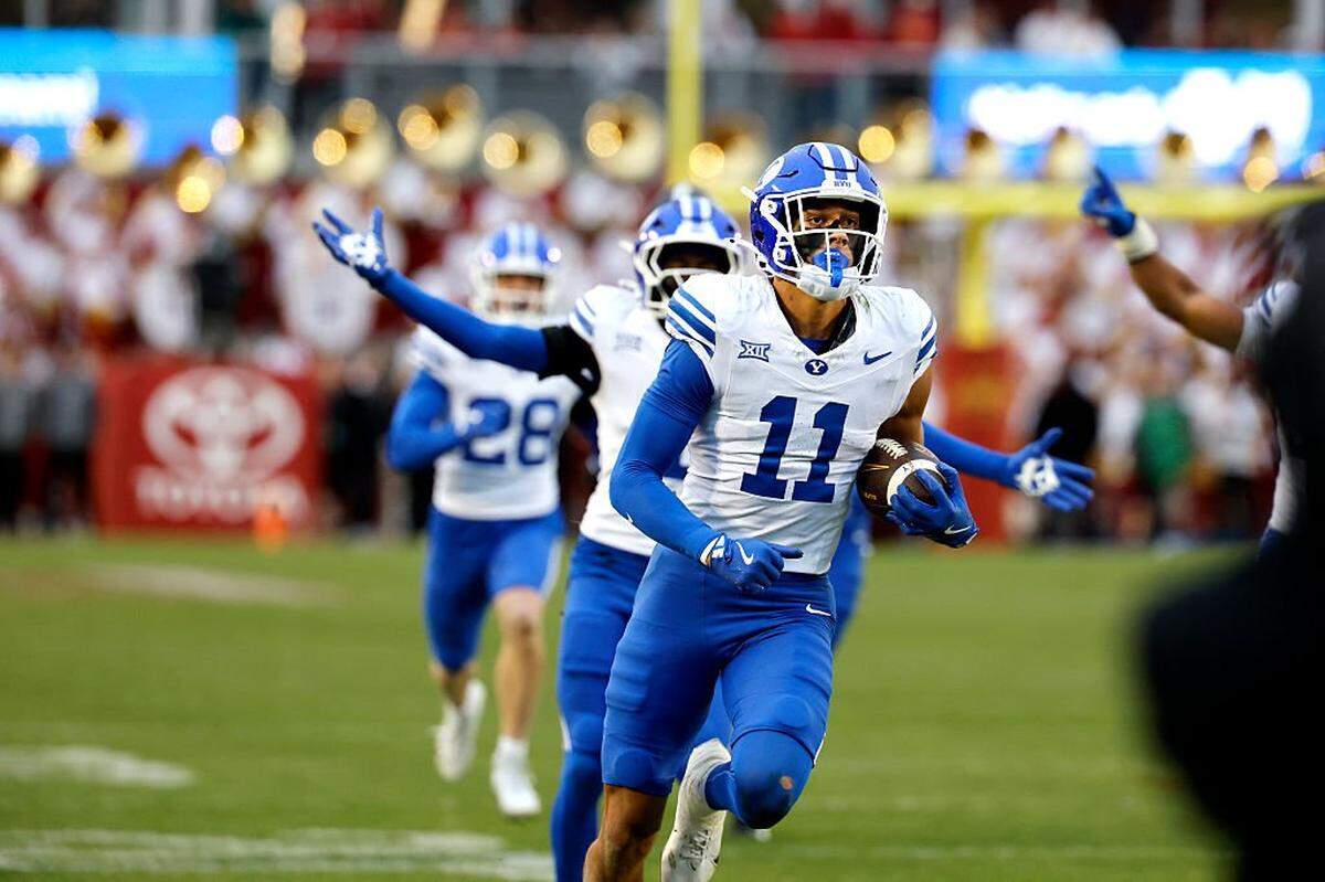 AMES, IA - OCTOBER 25: Safety Faletau Satuala #11 of the BYU Cougars retuns a pass interception to score a touchdown in the second half of play againstb the Iowa State Cyclones at Jack Trice Stadium on October 25, 2025, in Ames, Iowa. The BYU Cougars won 41-27 over the Iowa State Cyclones. (Photo by David Purdy/Getty Images)