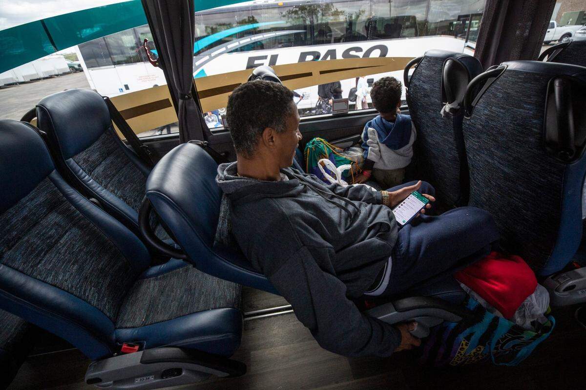 Three-year-old Moises, the son of Kristian Gonzalez Perez and Katiuska Leal Moreno, looks out the window as his bus gets ready to head out to New York City from the Migrant Welcome Center in El Paso, Texas.Venezuelan Migrant Nyc2278