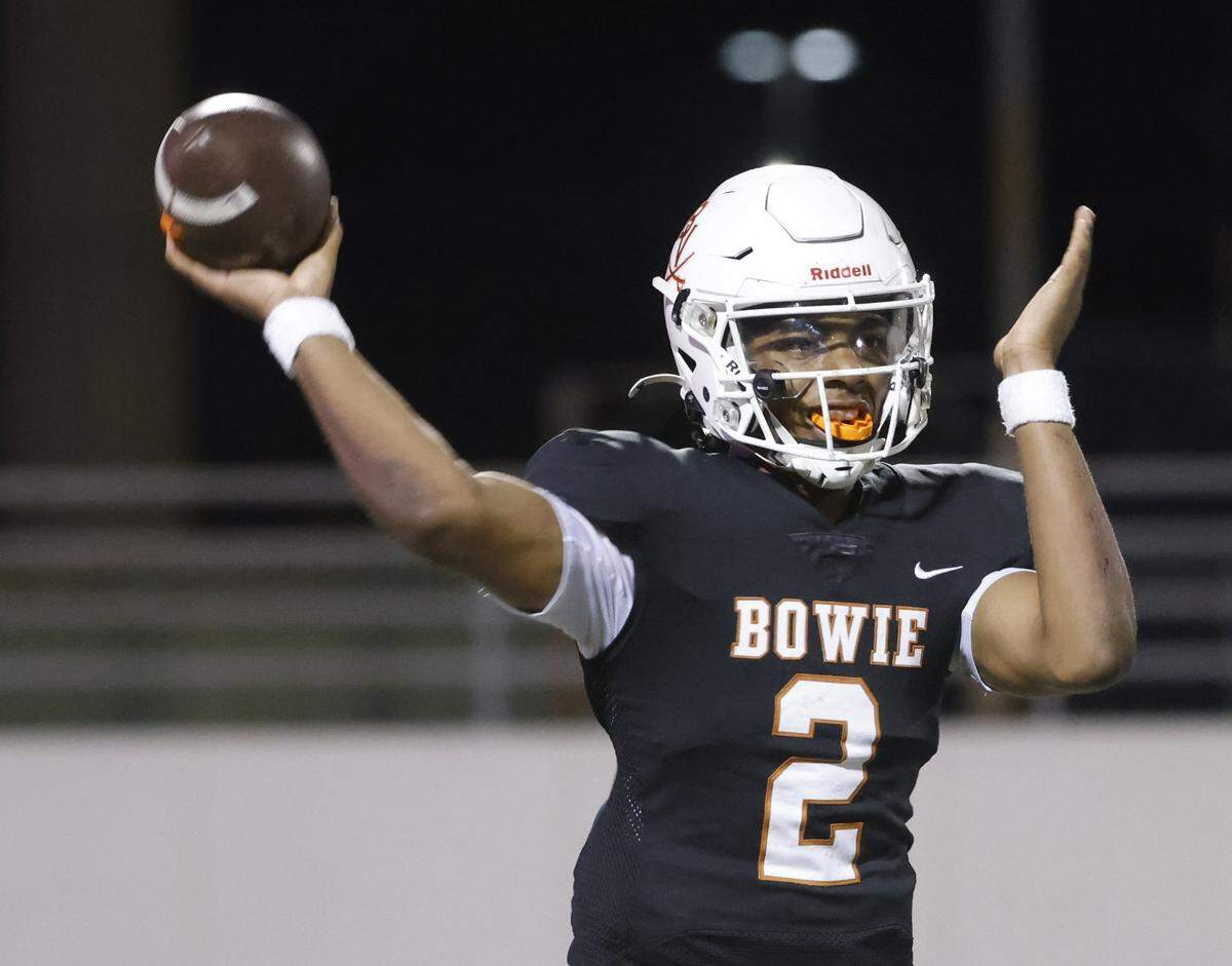 Bowie quarterback Jayden Bibbs (2) tosses a completion to the sidelines during the second half of a UIL football game between South Grand Prairie and Arlington Bowie at UTA Maverick Stadium in Arlington, Texas, Thursday Nov. 06, 2025.