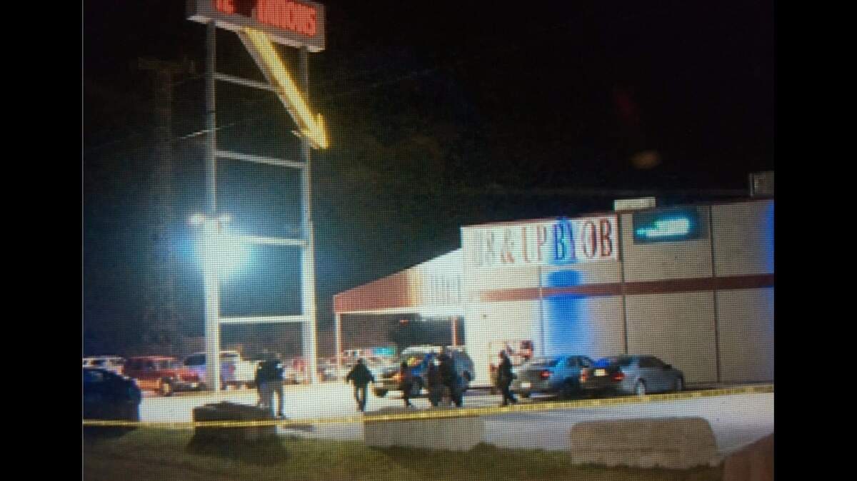 Authorities are looking for a suspect in the shooting deaths of two men at the Temptations adult club.