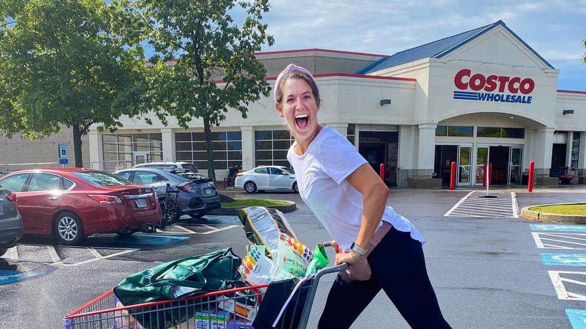 A Costco shopper with a full shopping cart