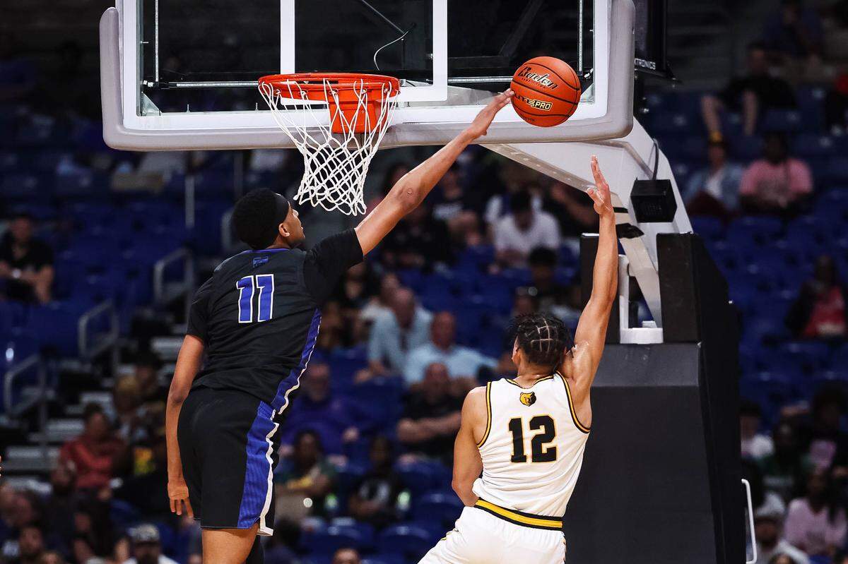 North Crowley forward Trey Hall (11) blocks a shot from a San Antonio Brennan player in the Class 6A Division I state championship game Saturday at the Alamodome in San Antonio.
