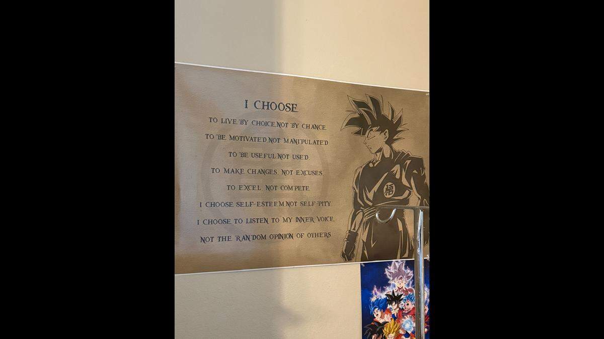 A poster in Wael Tarabishi’s home displays the character Goku from the groundbreaking anime series “Dragon Ball”