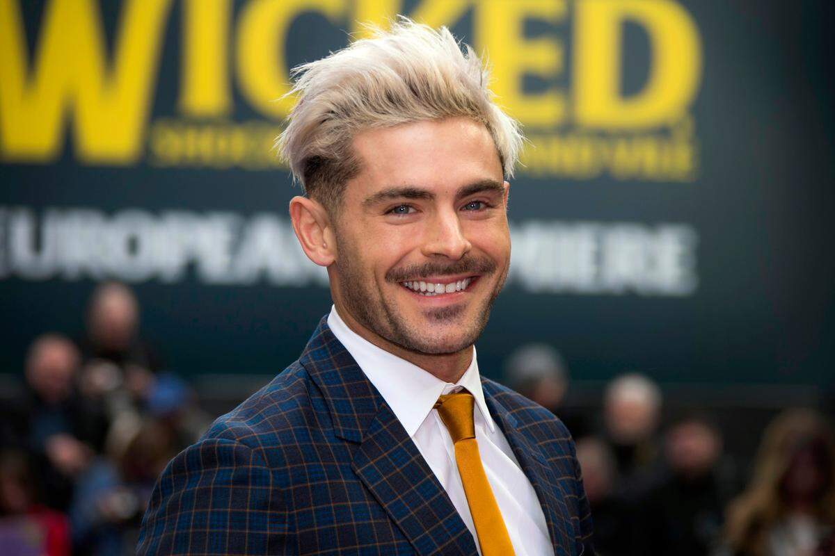 Actor Zac Efron poses for photographers upon arrival at a premiere in London. (Photo by Joel C Ryan/Invision/AP, File)