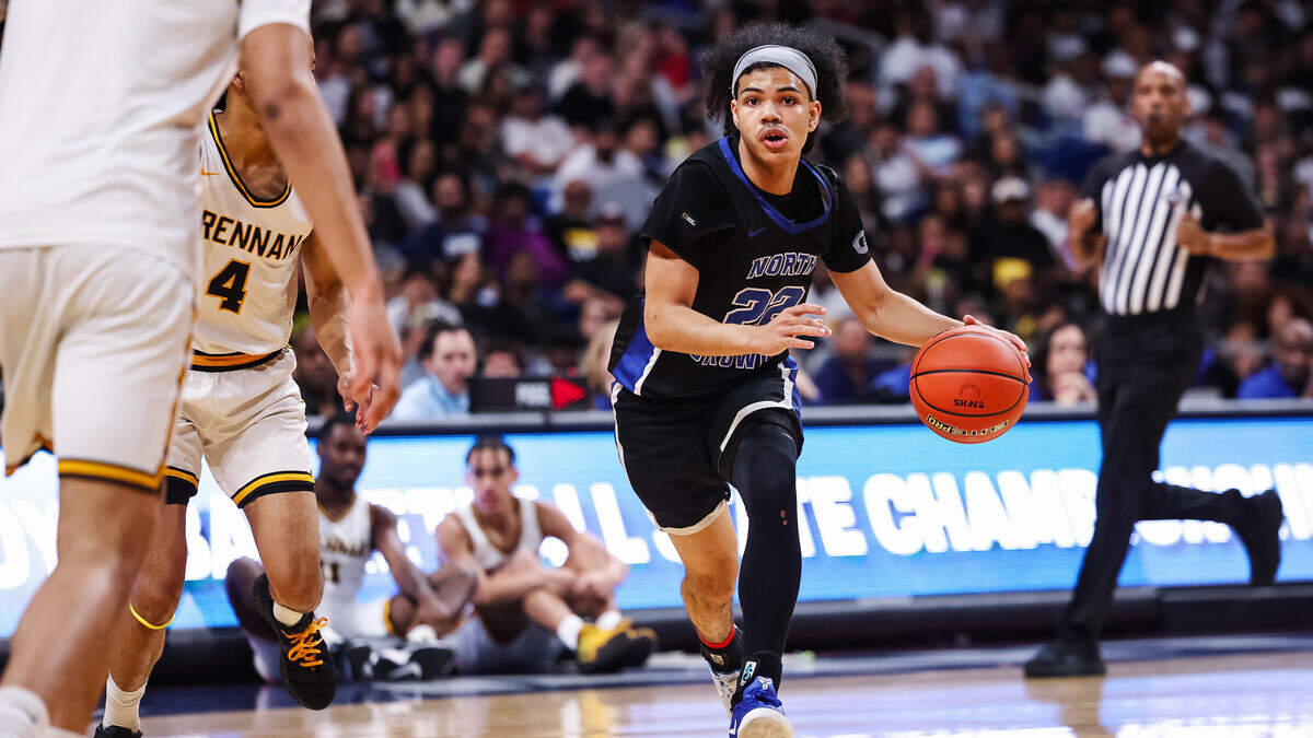 North Crowley guard Isaak Hayes (22) drives with the ball past a San Antonio Brennan defender in the Class 6A Division I state championship at The Alamodome in San Antonio, Texas, March 14, 2026.