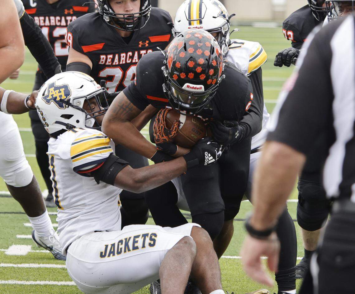 Aledo running back Kaden Winkfield (21) scores the Bearcats first touchdown against Arlington Heights during the first half of a UIL Class 5A Division I Regional on Friday Nov. 28, 2025 at Crowley ISD Multi-Purpose Stadium in Fort Worth, Texas.