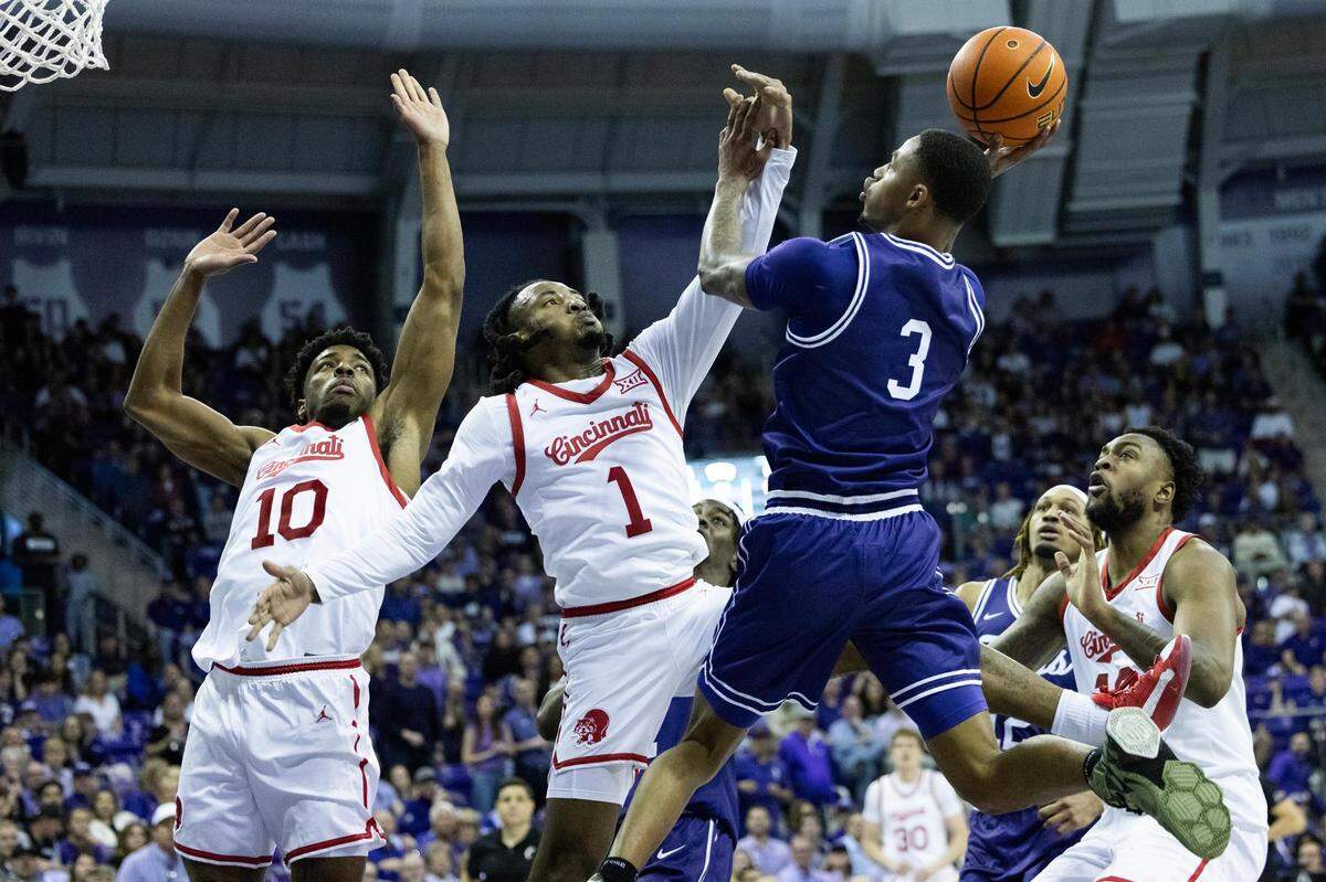 TCU Avery Anderson III (3) goes up for a contested layup during the first half of the Big XII match up between the TCU Horned Frogs and the Cincinnati Bearcats at Schollmaier Arena in Fort Worth on Saturday.