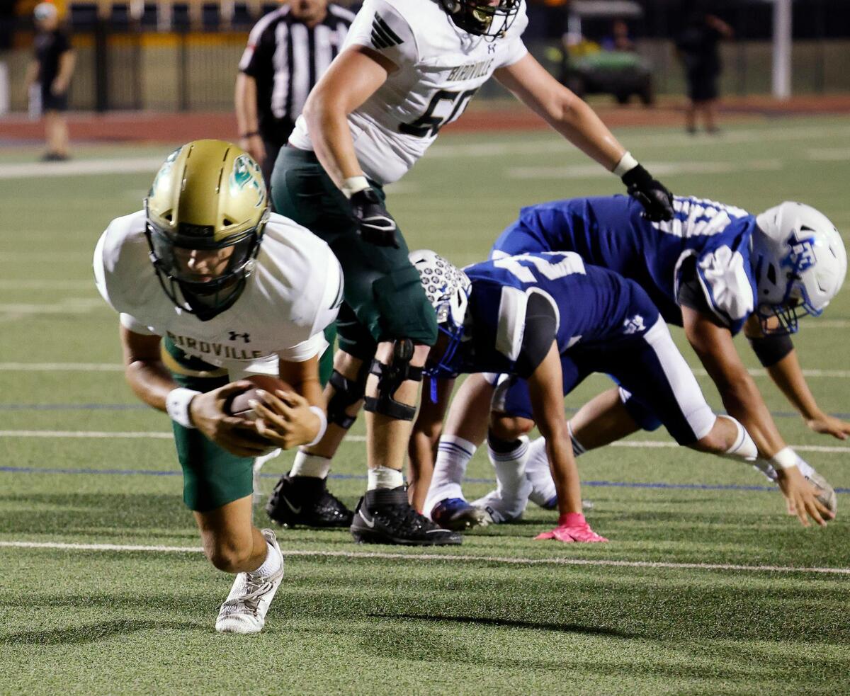 Birdville quarterback Noah Normand (4) dives for the end zone in the second half of a UIL football game at Standridge Stadium in Carrollton, Texas, Thursday Sept. 07, 2023. Birdville defeated RL Turner 48-18. (Special to the Star-Telegram Bob Booth)