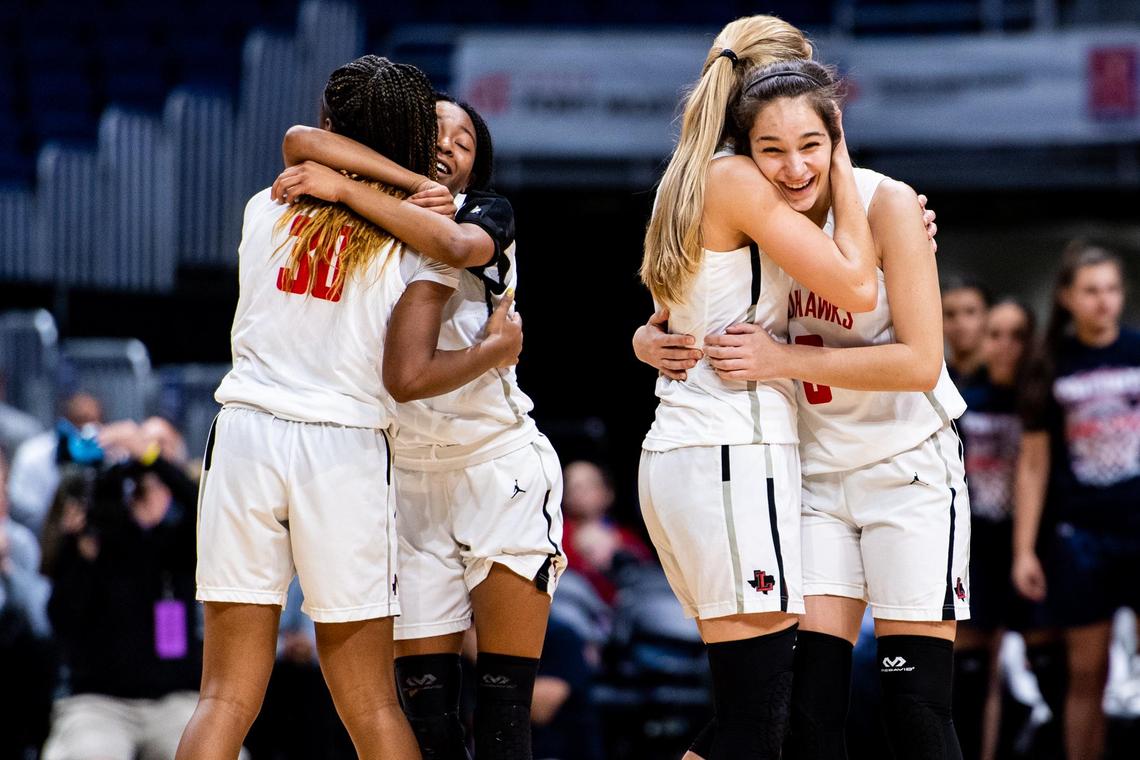 The Redhawks hug on the court knowing they’ve won as their teamate sinks another freethrow extneding their lead out of reach for San Antonio Veterans Memorial late in the 4th quarter of the 5A State Championship game at the Alamodome in San Antonio on March 7th, 2020. (Matt Smith: Special to the Star-Telegram).