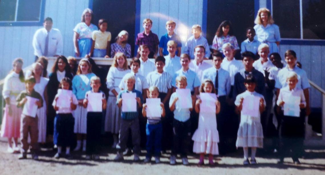 Kathy Durbin, fourth from the left in a blue sweater, stands here with her class at Faith Baptist Church in Wildomar, California. She says one of the youth workers molested her and the pastor sent him out of state. The man was never charged.