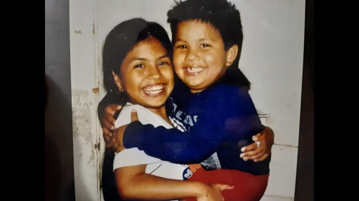 Maria Rosales (left) holds her brother, Johnny Lee Lopez (right), in this childhood photo. Johnny Lee learned around the age of 10 he would have to go on dialysis because of a kidney disease called end-stage renal failure.