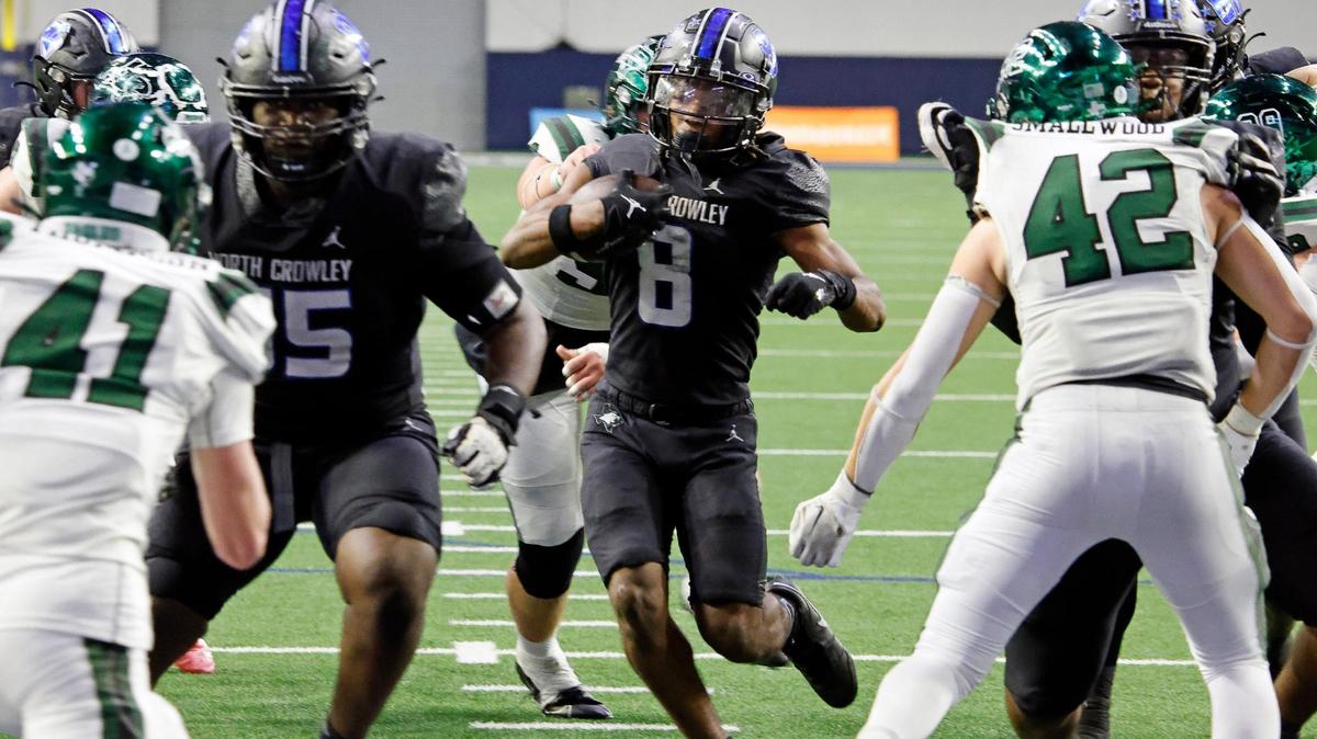 North Crowley running back Ashton Searl (8) takes it up the middle for six in the second half of a UIL Class 6A Division 1 football regional-round playoff game at The Ford Center in Frisco, Texas, Saturday, Oct. 25, 2023.