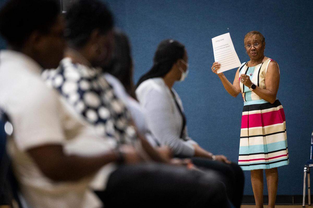 Trudy Darden, curriculum developer, talks to trainees prepping to teach students reading at summer camp Thursday, June 9, 2022, at Ebenezer Baptist Church in Fort Worth.
