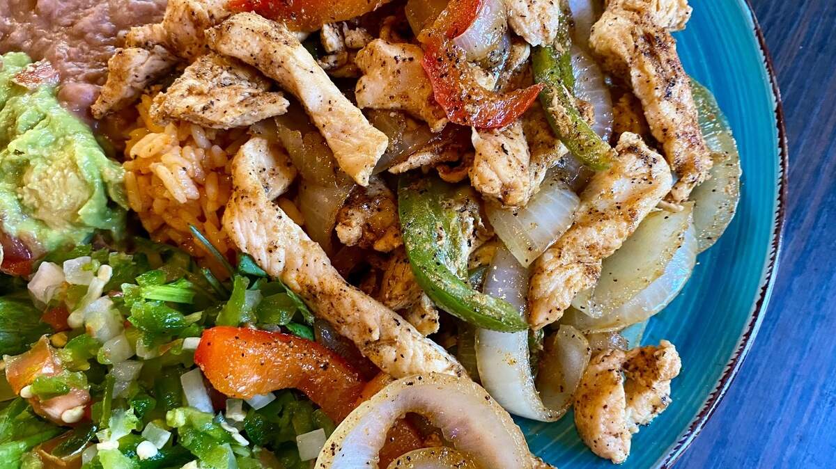 Chicken fajitas at Los Asaderos, a small family restaurant better known foir green chicken enchiladas.