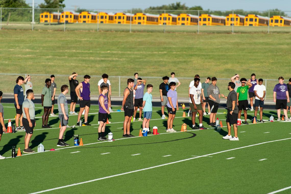 Head Coach Marshall Williams talks to his players while maintaining social distance, before splitting them into groups at Timber Creek high school on June 8th, 2020, the first day of sanctioned at school workouts since the outbreak of COVID-19 in the United States. Photo: Matt Smith (Special to the Star-Telegram).